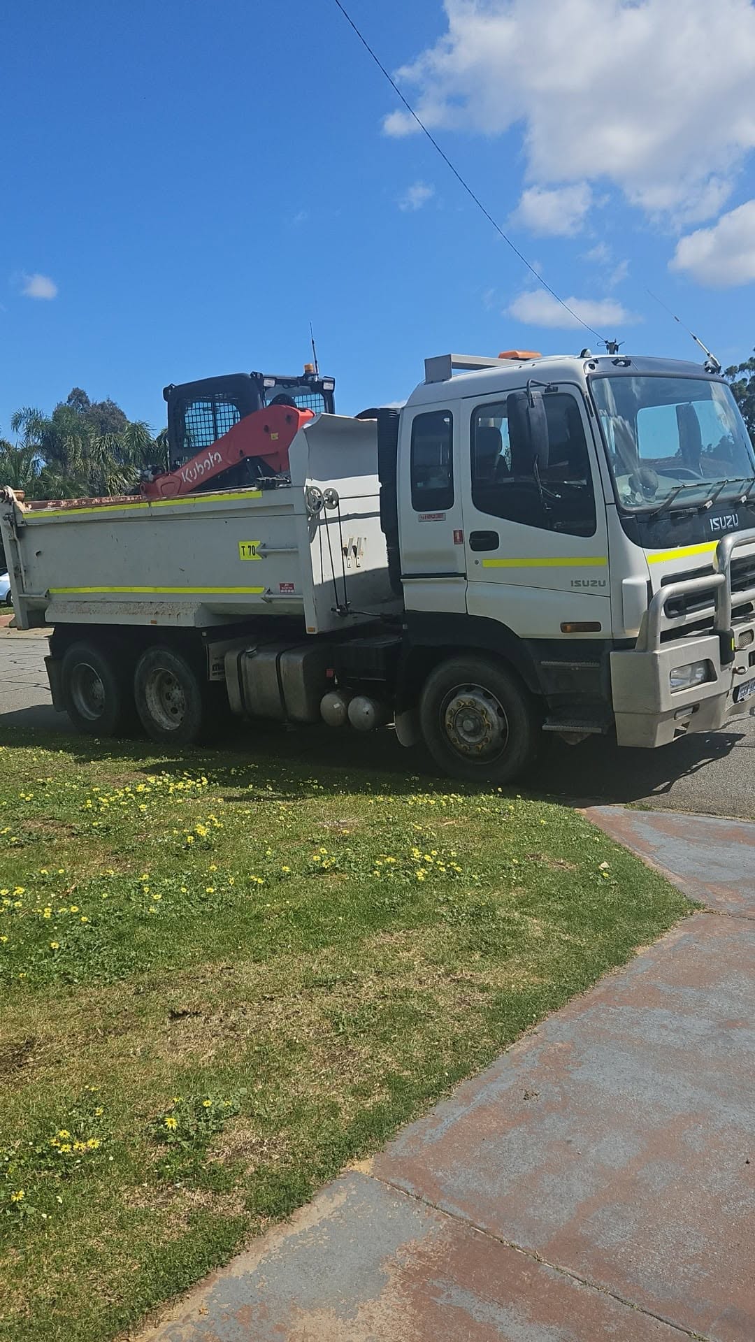 Tip truck and bobcat